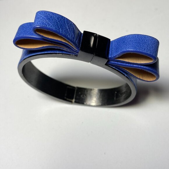 Vince Camuto Jewelry - Vince Camuto Blue Bow Hinged Bracelet. Fits up to 6" wrist.
